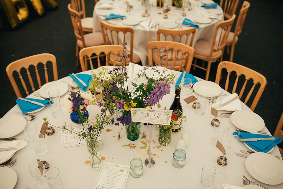 Anna wore a pale gold wedding dress designed by Jane Bourvis for her English country wedding. Photography by Lucy Greenhill.