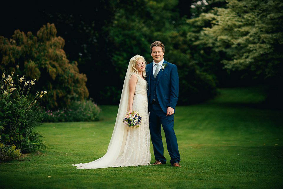 Anna wore a pale gold wedding dress designed by Jane Bourvis for her English country wedding. Photography by Lucy Greenhill.