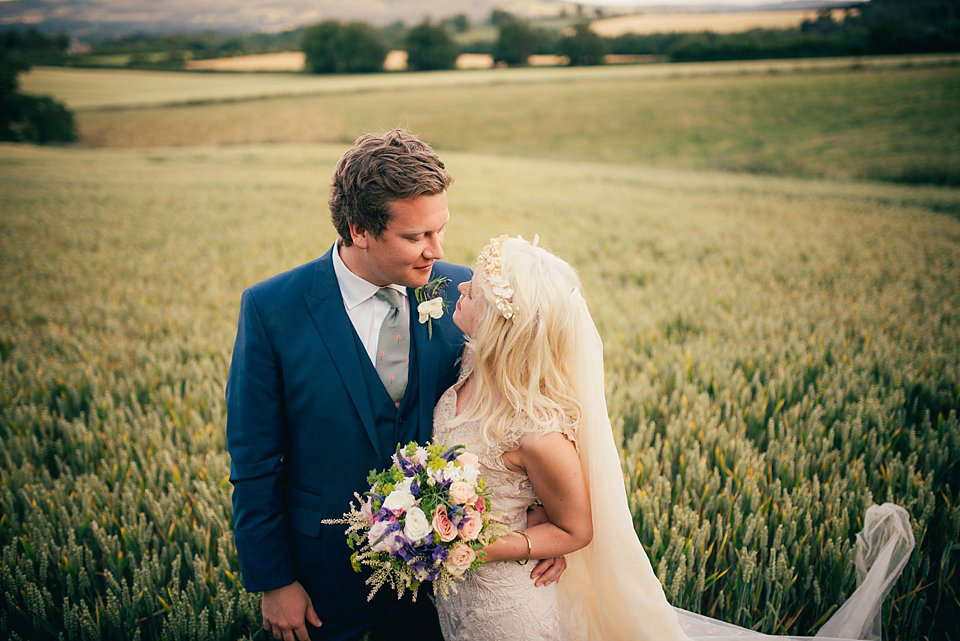 Anna wore a pale gold wedding dress designed by Jane Bourvis for her English country wedding. Photography by Lucy Greenhill.