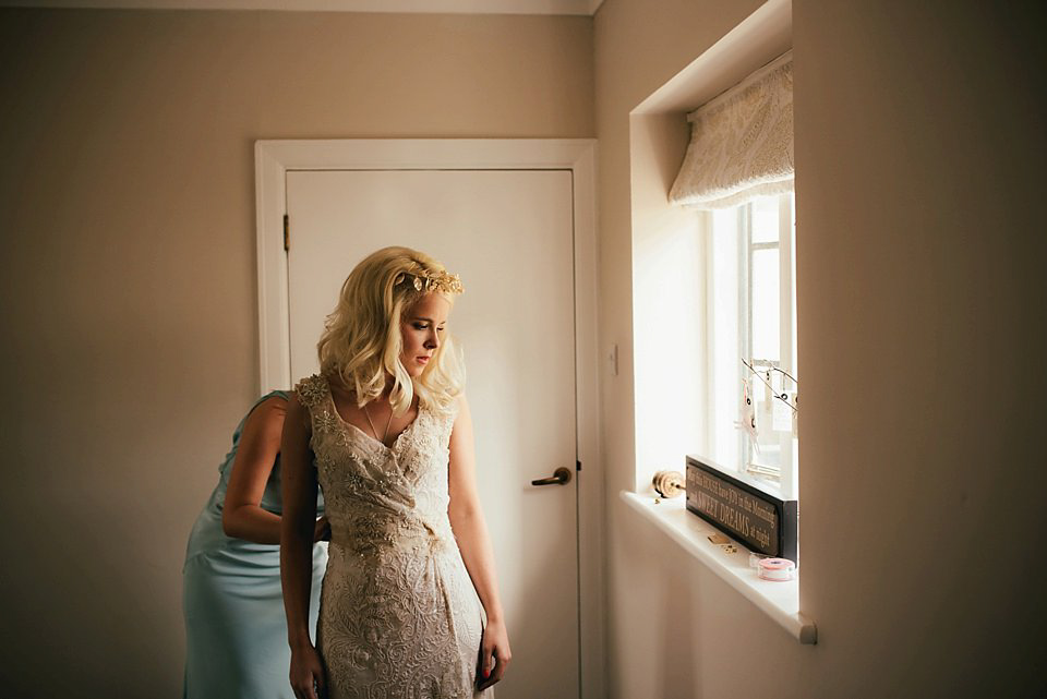 Anna wore a pale gold wedding dress designed by Jane Bourvis for her English country wedding. Photography by Lucy Greenhill.