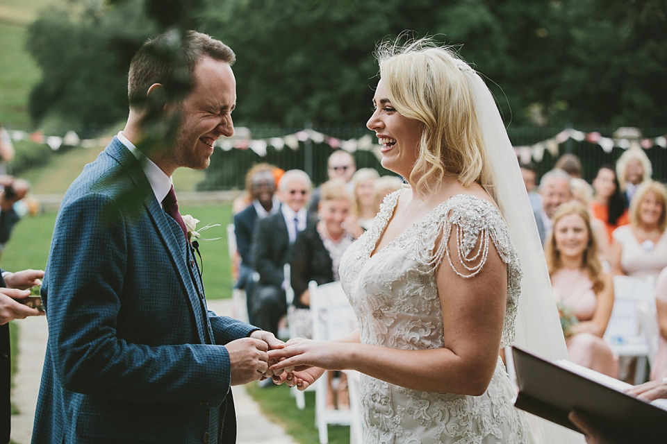 Terri wore an Anna Campbell inspired gown made by her mum, for her outdoor Summer wedding in the Cotswolds. Photography by McKinley Rodgers, film by Story Catchers Wedding Films.