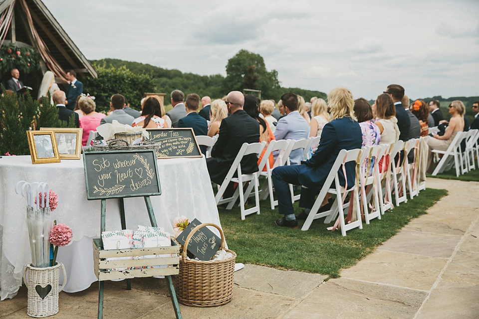 Terri wore an Anna Campbell inspired gown made by her mum, for her outdoor Summer wedding in the Cotswolds. Photography by McKinley Rodgers, film by Story Catchers Wedding Films.