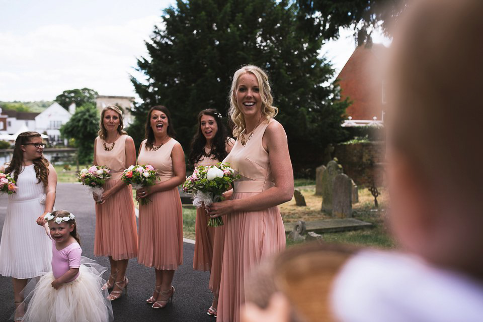 Bryony wore a gown with a floral back by Claire Pettibone from Blackburn Bridal for her Summer wedding held at her husband's family home. Photography by Kristian Leven.