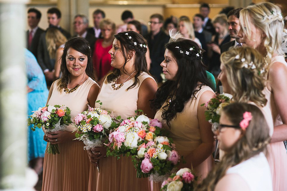 Bryony wore a gown with a floral back by Claire Pettibone from Blackburn Bridal for her Summer wedding held at her husband's family home. Photography by Kristian Leven.