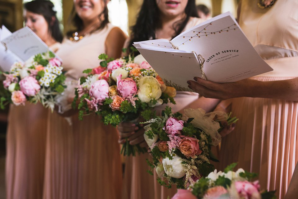 Bryony wore a gown with a floral back by Claire Pettibone from Blackburn Bridal for her Summer wedding held at her husband's family home. Photography by Kristian Leven.