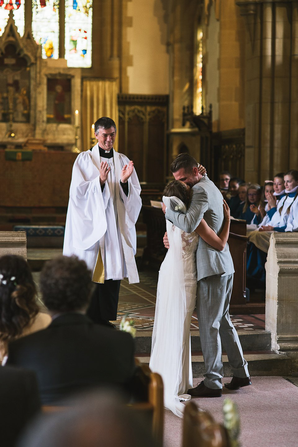 Bryony wore a gown with a floral back by Claire Pettibone from Blackburn Bridal for her Summer wedding held at her husband's family home. Photography by Kristian Leven.