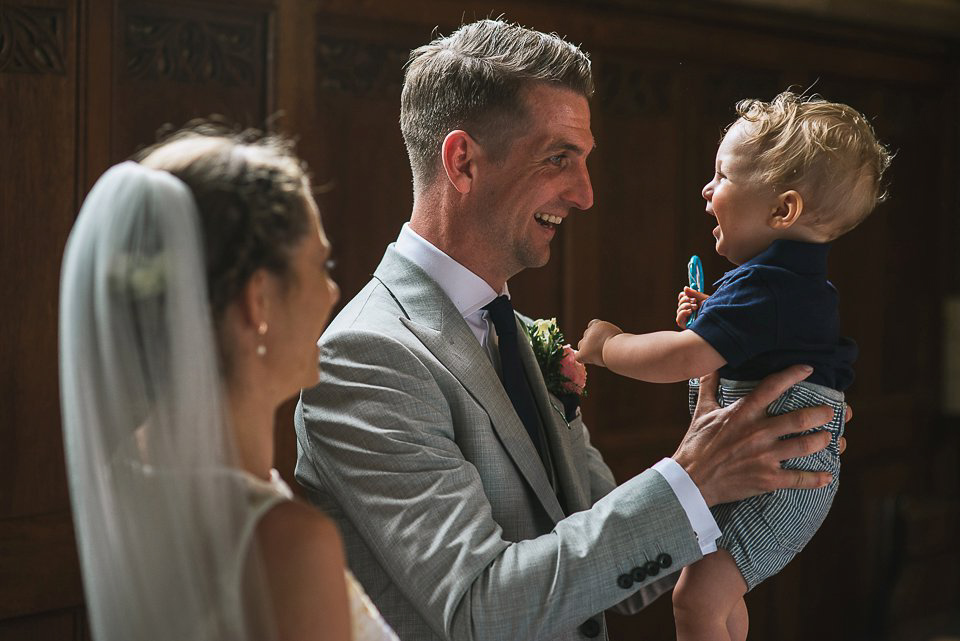 Bryony wore a gown with a floral back by Claire Pettibone from Blackburn Bridal for her Summer wedding held at her husband's family home. Photography by Kristian Leven.