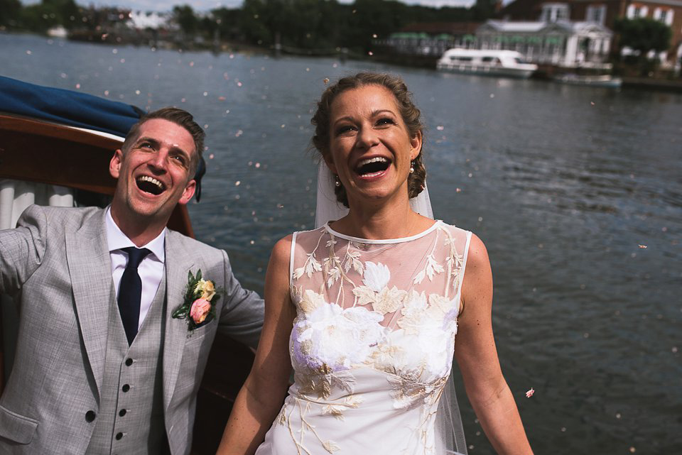 Bryony wore a gown with a floral back by Claire Pettibone from Blackburn Bridal for her Summer wedding held at her husband's family home. Photography by Kristian Leven.