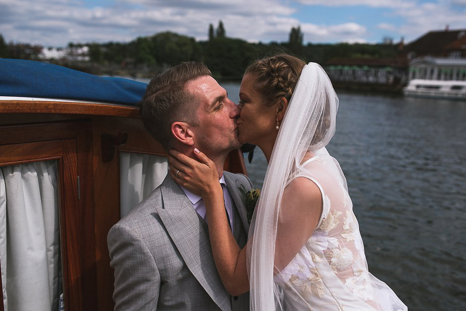 Bryony wore a gown with a floral back by Claire Pettibone from Blackburn Bridal for her Summer wedding held at her husband's family home. Photography by Kristian Leven.