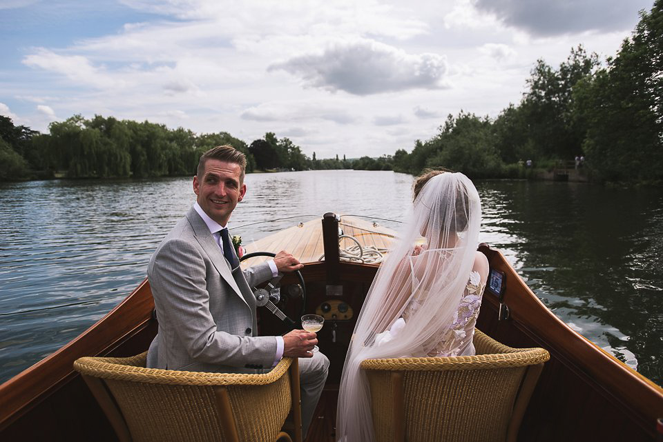 Bryony wore a gown with a floral back by Claire Pettibone from Blackburn Bridal for her Summer wedding held at her husband's family home. Photography by Kristian Leven.