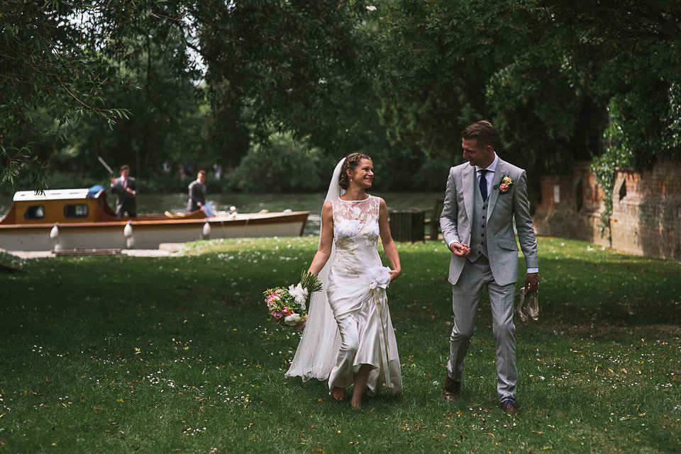 Bryony wore a gown with a floral back by Claire Pettibone from Blackburn Bridal for her Summer wedding held at her husband's family home. Photography by Kristian Leven.