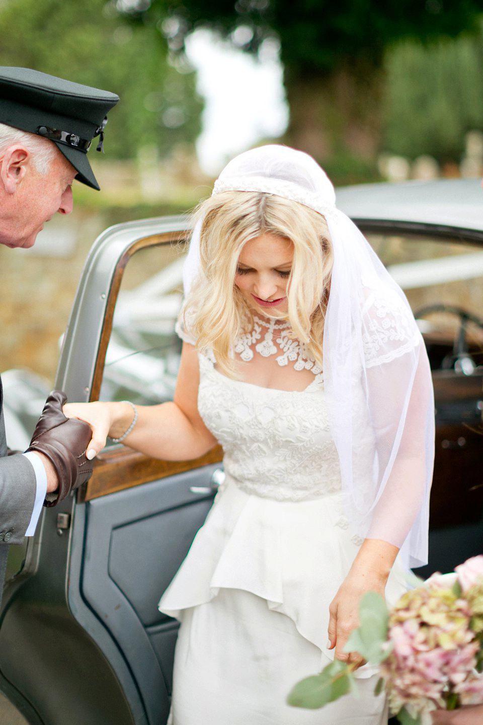 George wears a Temperley London gown with beautiful peplum detail for her eccentric, quirky and elegant Aynhoe Park wedding. Photography by Caught The Light.