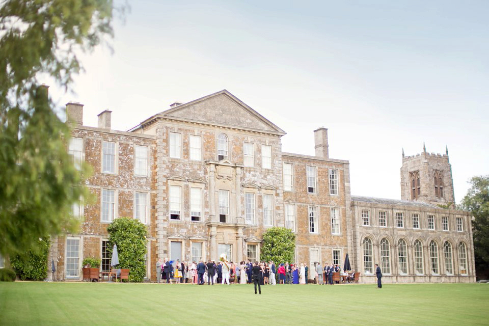 George wears a Temperley London gown with beautiful peplum detail for her eccentric, quirky and elegant Aynhoe Park wedding. Photography by Caught The Light.