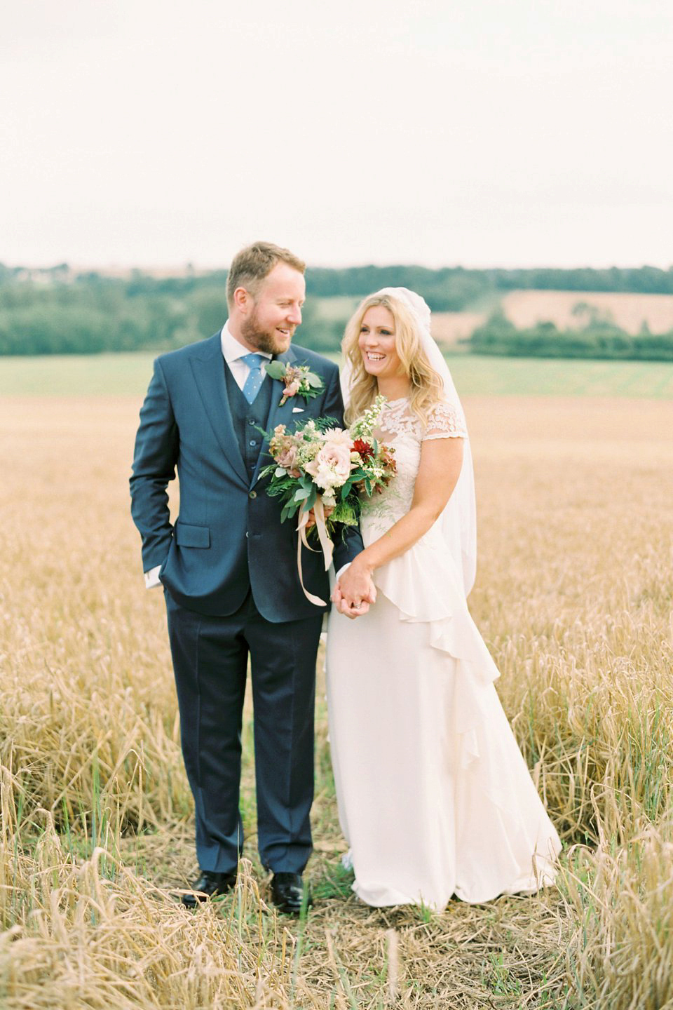 George wears a Temperley London gown with beautiful peplum detail for her eccentric, quirky and elegant Aynhoe Park wedding. Photography by Caught The Light.