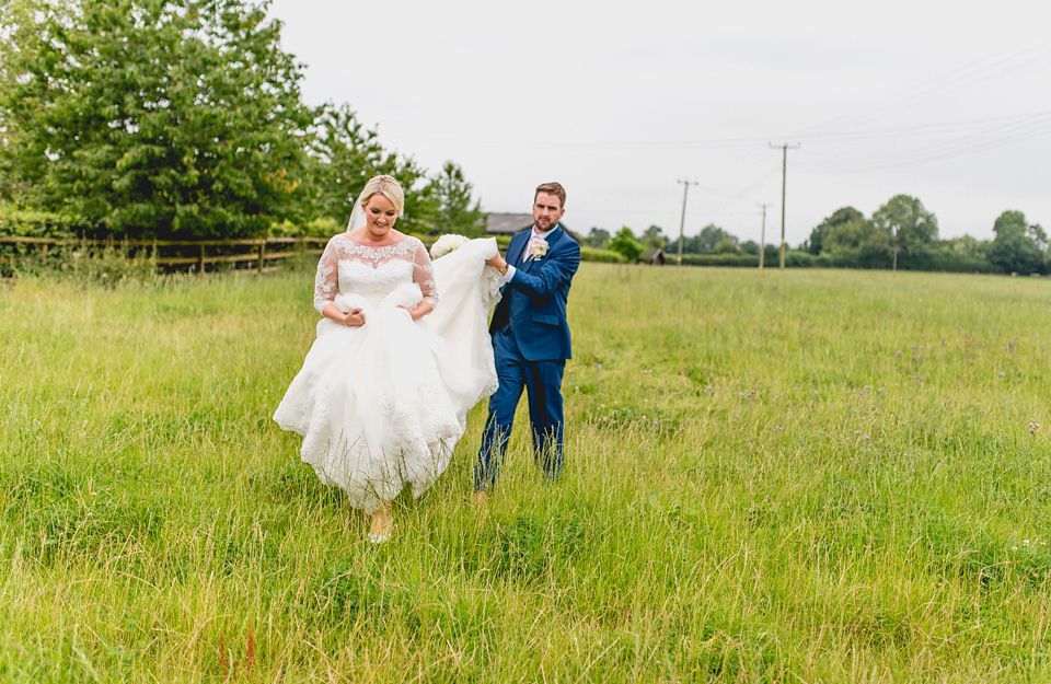 Rebecca wore a gown by Charlotte Balbier for her romantic and quintessentially English country wedding. Photography by Lisa Carpenter.
