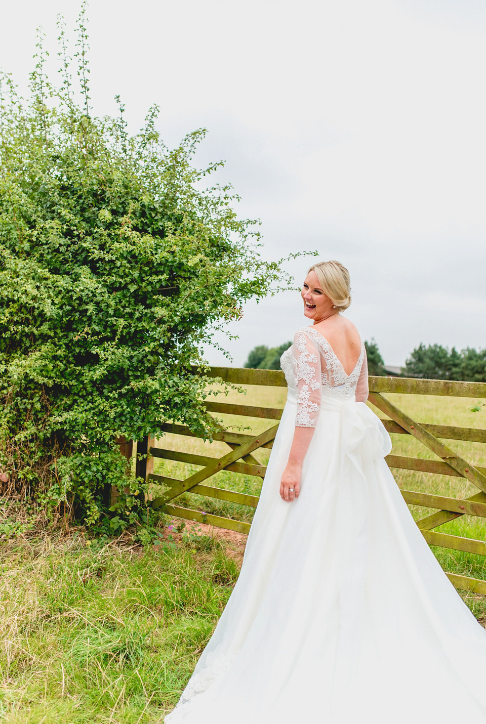 Rebecca wore a gown by Charlotte Balbier for her romantic and quintessentially English country wedding. Photography by Lisa Carpenter.