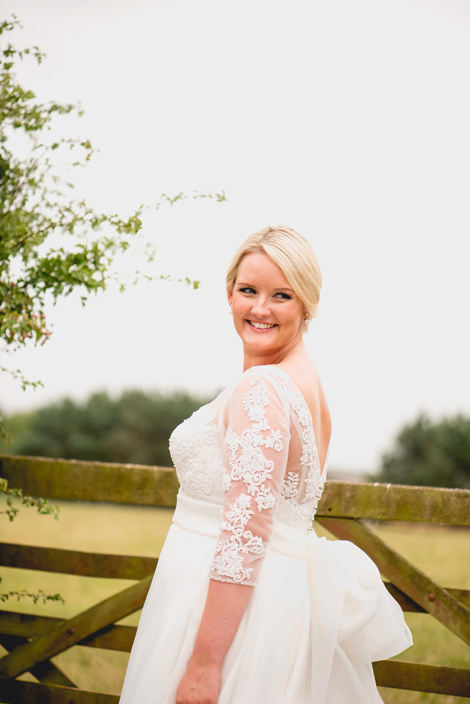 Rebecca wore a gown by Charlotte Balbier for her romantic and quintessentially English country wedding. Photography by Lisa Carpenter.