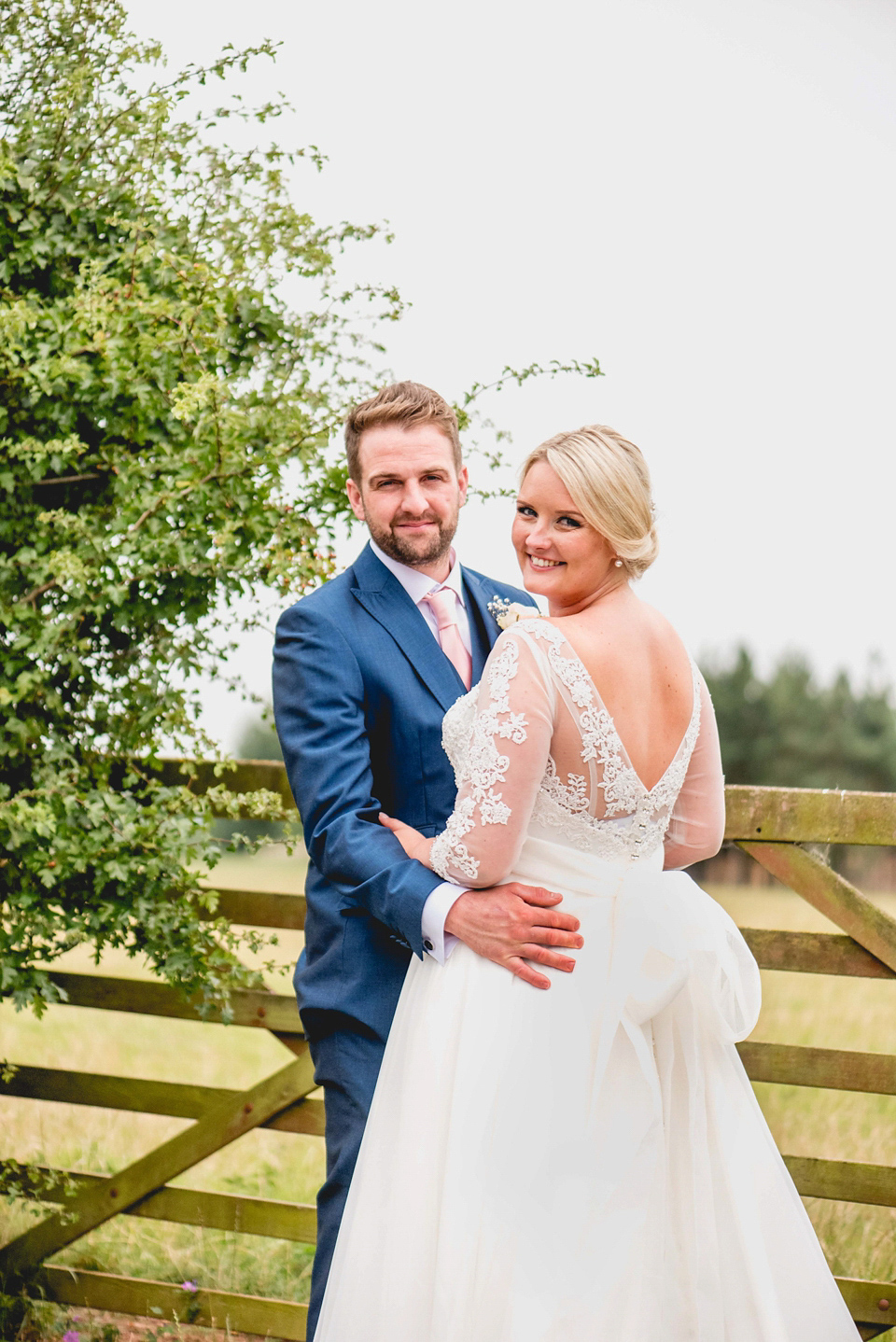 Rebecca wore a gown by Charlotte Balbier for her romantic and quintessentially English country wedding. Photography by Lisa Carpenter.