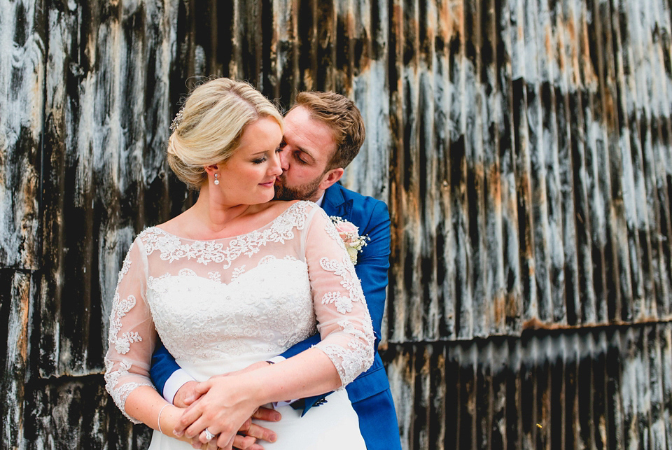 Rebecca wore a gown by Charlotte Balbier for her romantic and quintessentially English country wedding. Photography by Lisa Carpenter.