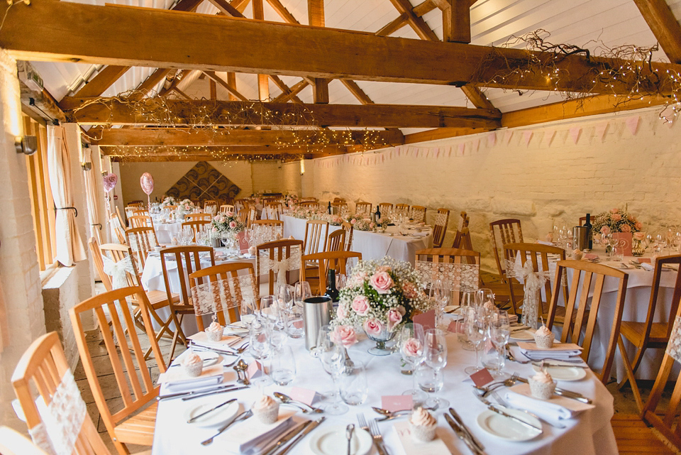 Rebecca wore a gown by Charlotte Balbier for her romantic and quintessentially English country wedding. Photography by Lisa Carpenter.