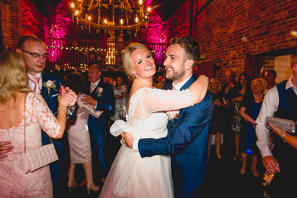 Rebecca wore a gown by Charlotte Balbier for her romantic and quintessentially English country wedding. Photography by Lisa Carpenter.