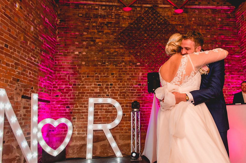 Rebecca wore a gown by Charlotte Balbier for her romantic and quintessentially English country wedding. Photography by Lisa Carpenter.