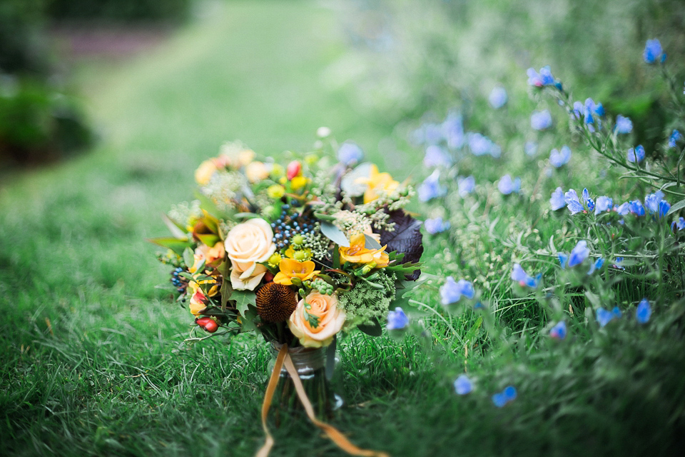 Holly wore an Eliza Jane Howell gown for her colourful, outdoor wedding in Scotland. Images by Solen Photography.