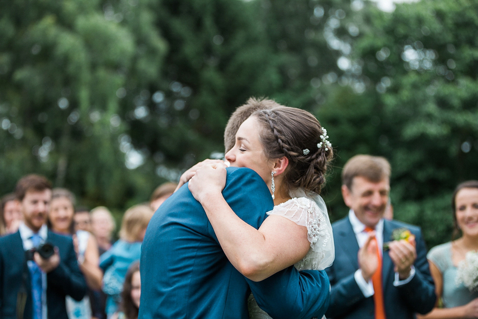 Holly wore an Eliza Jane Howell gown for her colourful, outdoor wedding in Scotland. Images by Solen Photography.