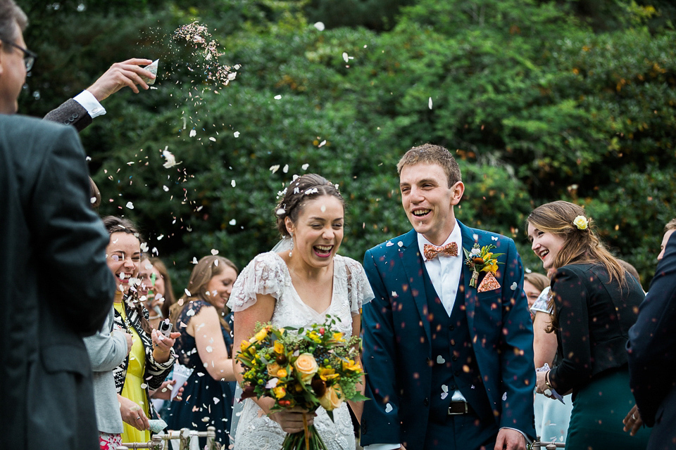 Holly wore an Eliza Jane Howell gown for her colourful, outdoor wedding in Scotland. Images by Solen Photography.