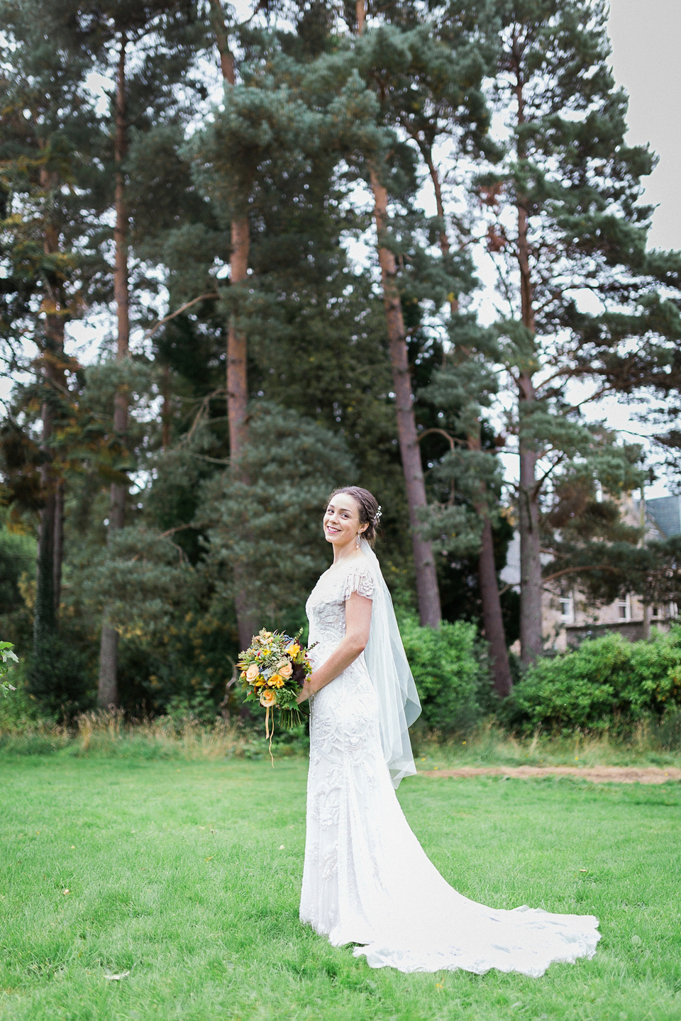 Holly wore an Eliza Jane Howell gown for her colourful, outdoor wedding in Scotland. Images by Solen Photography.