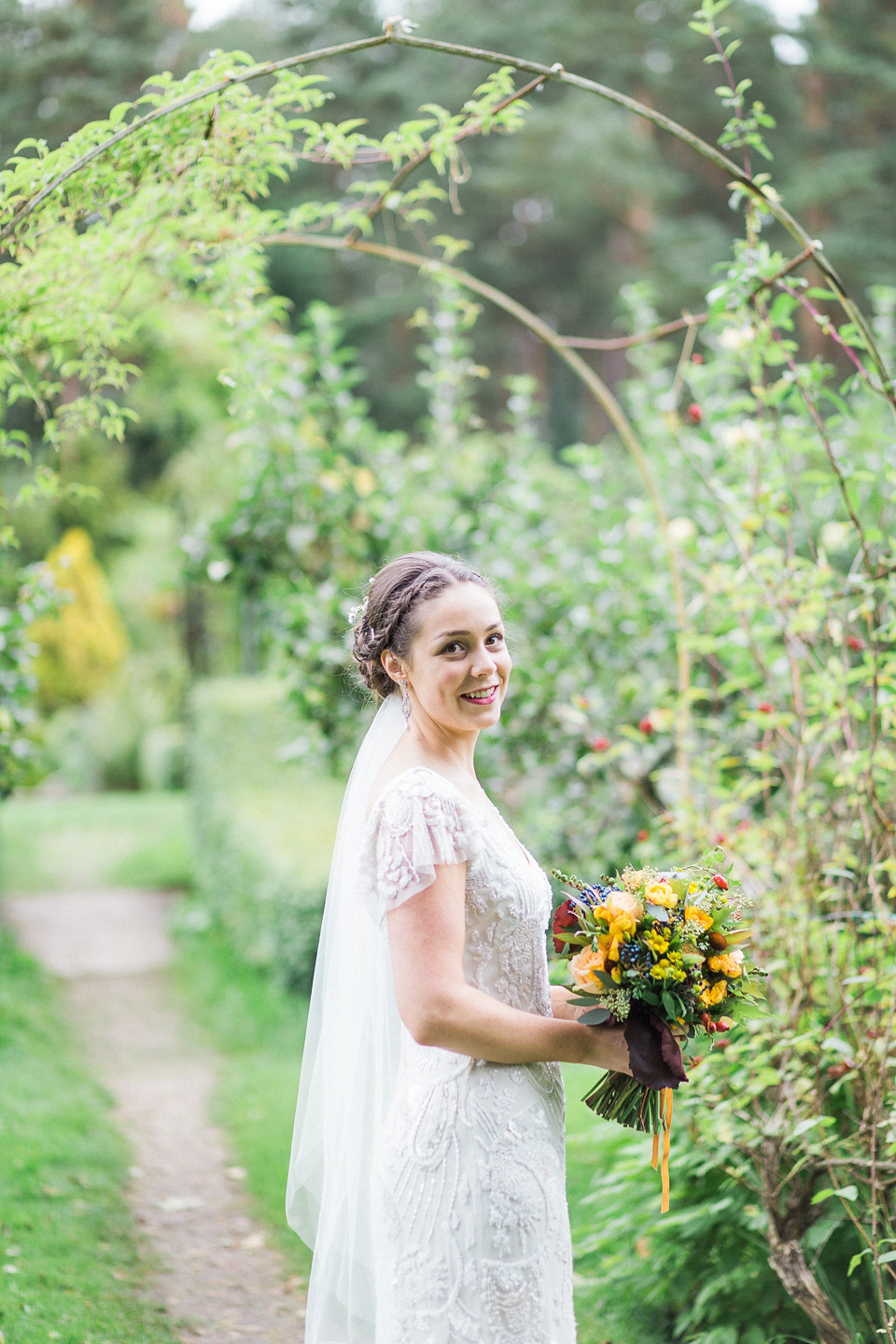 Holly wore an Eliza Jane Howell gown for her colourful, outdoor wedding in Scotland. Images by Solen Photography.