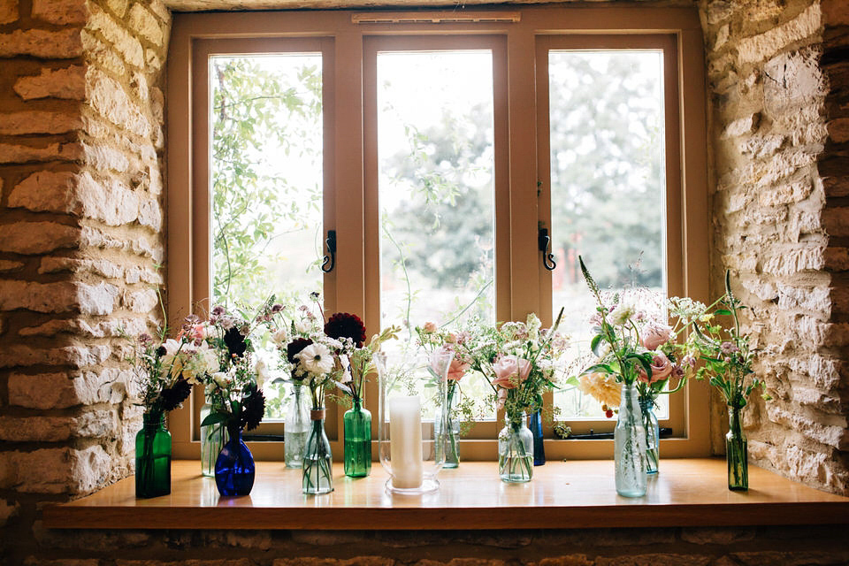 Katie wore a bespoke gown by London based designer Shanna Melville for her romantic Autumn wedding in the Cotswolds. Photography by Joseph Hall.