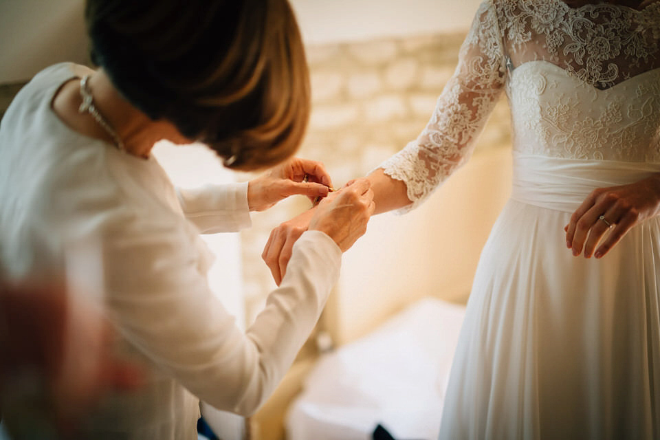 Katie wore a bespoke gown by London based designer Shanna Melville for her romantic Autumn wedding in the Cotswolds. Photography by Joseph Hall.