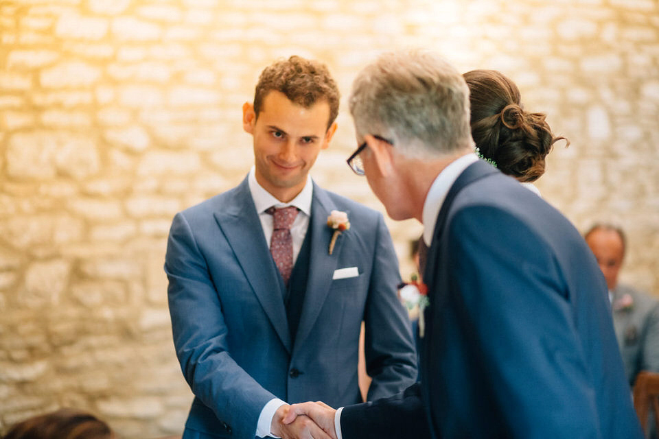 Katie wore a bespoke gown by London based designer Shanna Melville for her romantic Autumn wedding in the Cotswolds. Photography by Joseph Hall.