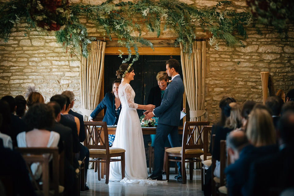 Katie wore a bespoke gown by London based designer Shanna Melville for her romantic Autumn wedding in the Cotswolds. Photography by Joseph Hall.