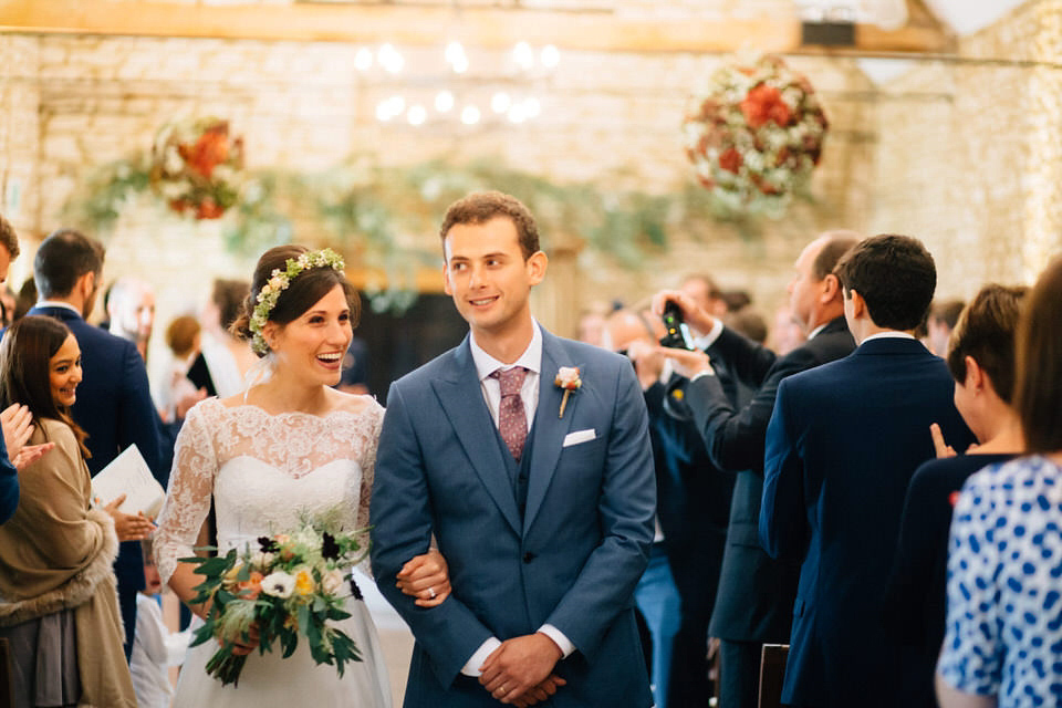 Katie wore a bespoke gown by London based designer Shanna Melville for her romantic Autumn wedding in the Cotswolds. Photography by Joseph Hall.