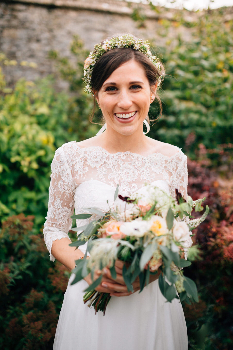 Katie wore a bespoke gown by London based designer Shanna Melville for her romantic Autumn wedding in the Cotswolds. Photography by Joseph Hall.