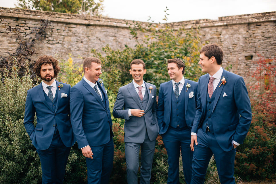 Katie wore a bespoke gown by London based designer Shanna Melville for her romantic Autumn wedding in the Cotswolds. Photography by Joseph Hall.