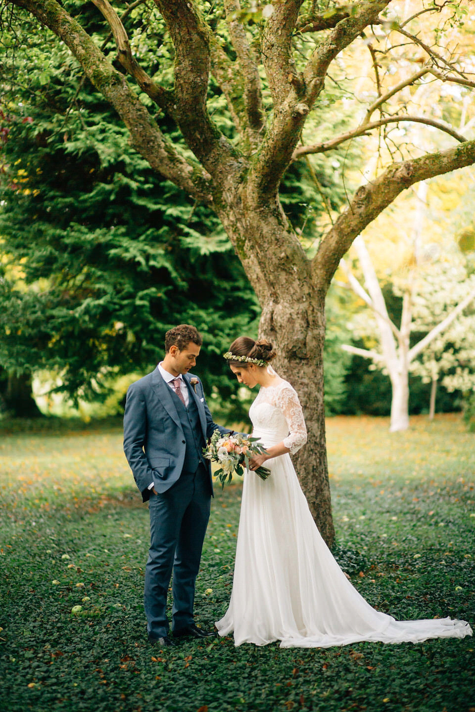 Katie wore a bespoke gown by London based designer Shanna Melville for her romantic Autumn wedding in the Cotswolds. Photography by Joseph Hall.