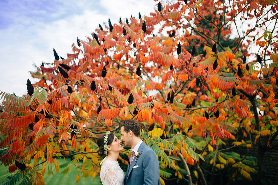 Katie wore a bespoke gown by London based designer Shanna Melville for her romantic Autumn wedding in the Cotswolds. Photography by Joseph Hall.