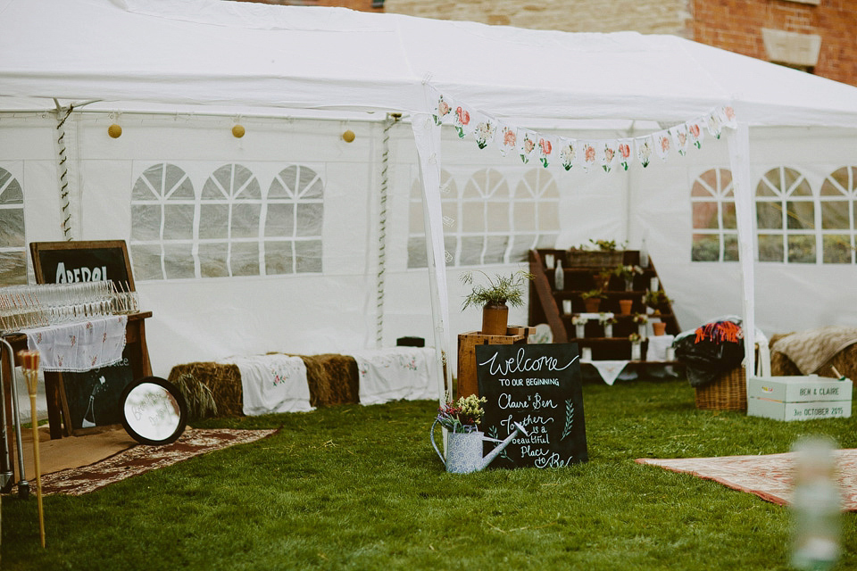 An elegant and quintessentially English village hall wedding in the Cotswolds. Bride Claire wore Ellis Bridals. Photography by David Jenkins.