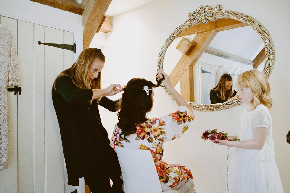 An elegant and quintessentially English village hall wedding in the Cotswolds. Bride Claire wore Ellis Bridals. Photography by David Jenkins.