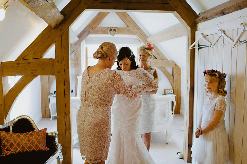 An elegant and quintessentially English village hall wedding in the Cotswolds. Bride Claire wore Ellis Bridals. Photography by David Jenkins.