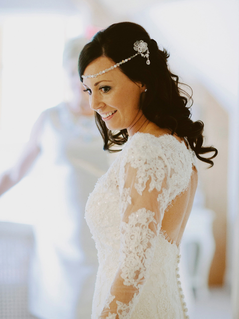 An elegant and quintessentially English village hall wedding in the Cotswolds. Bride Claire wore Ellis Bridals. Photography by David Jenkins.