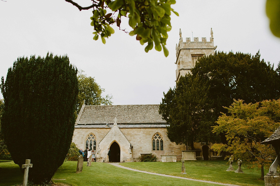 An elegant and quintessentially English village hall wedding in the Cotswolds. Bride Claire wore Ellis Bridals. Photography by David Jenkins.