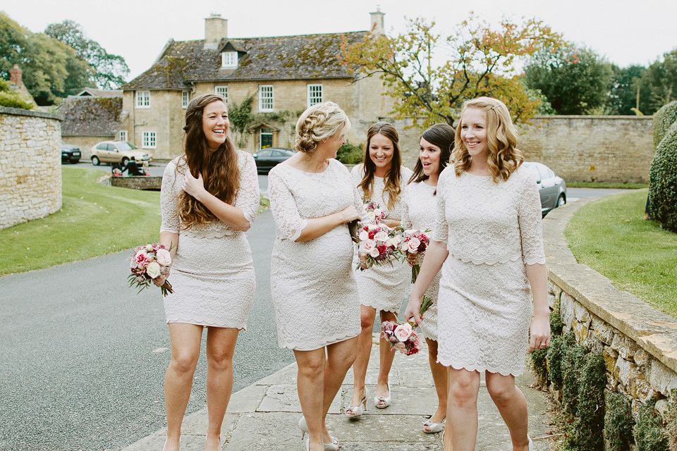 An elegant and quintessentially English village hall wedding in the Cotswolds. Bride Claire wore Ellis Bridals. Photography by David Jenkins.