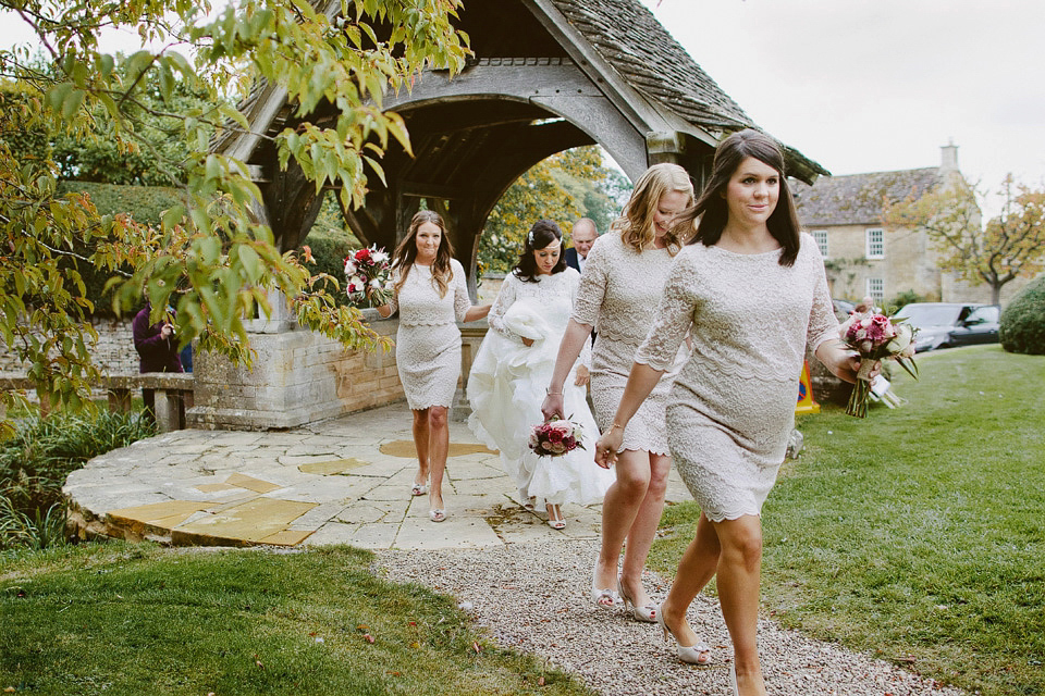 An elegant and quintessentially English village hall wedding in the Cotswolds. Bride Claire wore Ellis Bridals. Photography by David Jenkins.