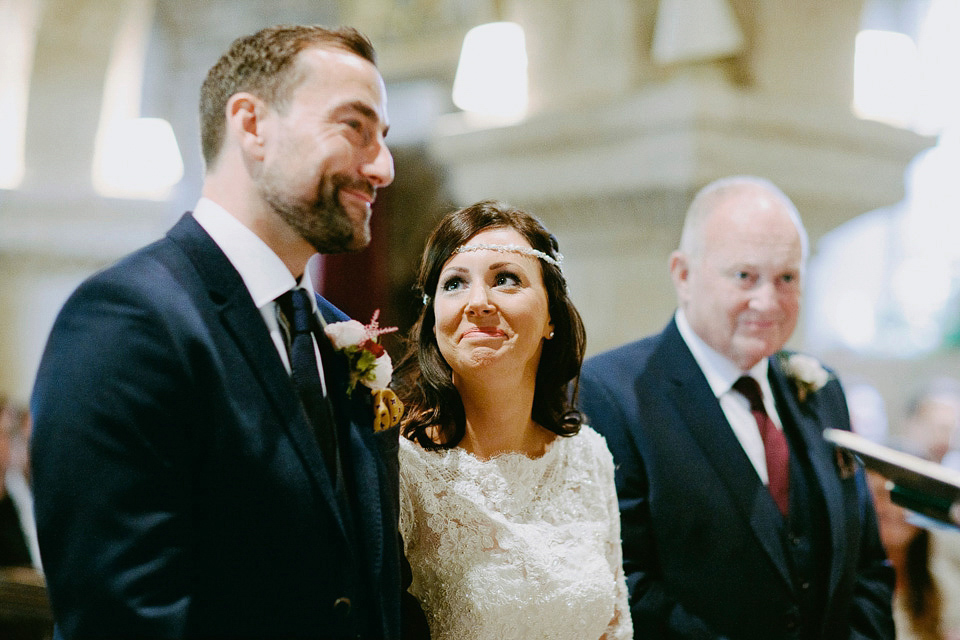 An elegant and quintessentially English village hall wedding in the Cotswolds. Bride Claire wore Ellis Bridals. Photography by David Jenkins.