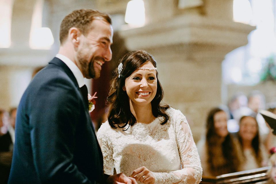 An elegant and quintessentially English village hall wedding in the Cotswolds. Bride Claire wore Ellis Bridals. Photography by David Jenkins.