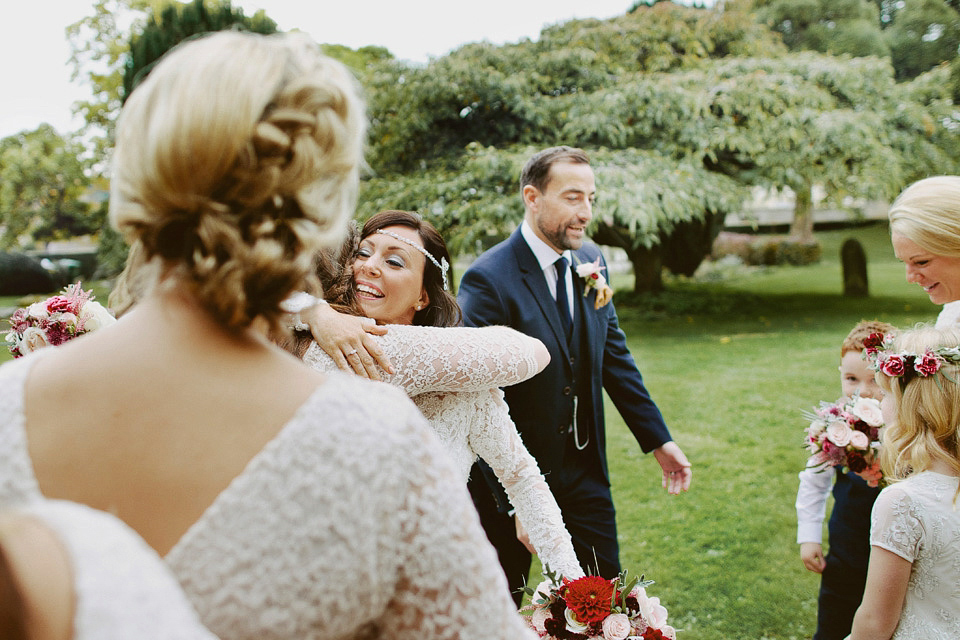 An elegant and quintessentially English village hall wedding in the Cotswolds. Bride Claire wore Ellis Bridals. Photography by David Jenkins.